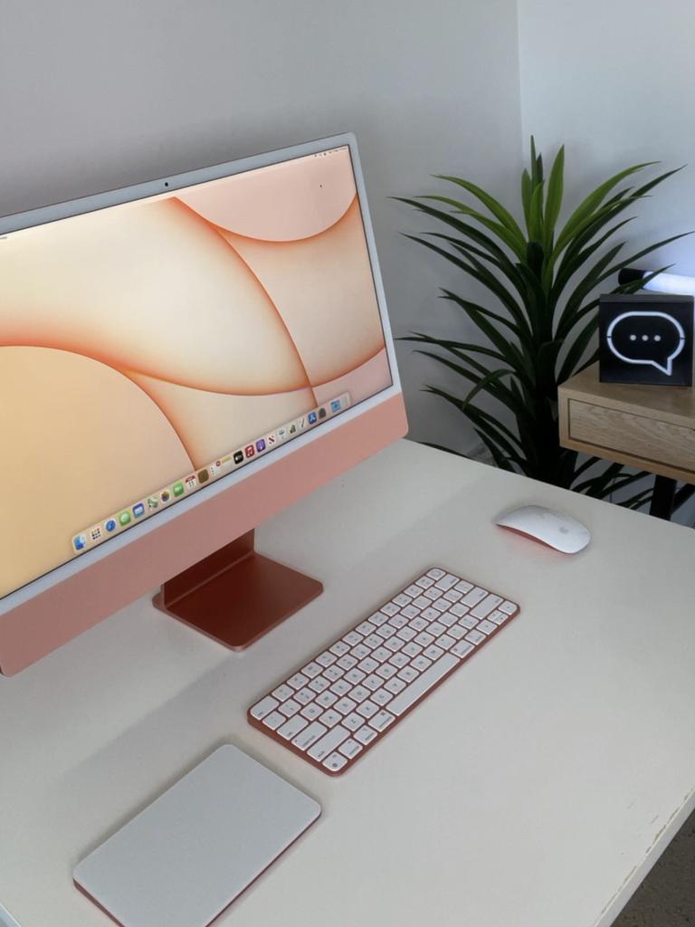 The iMac comes with a keyboard and mouse or trackpad.