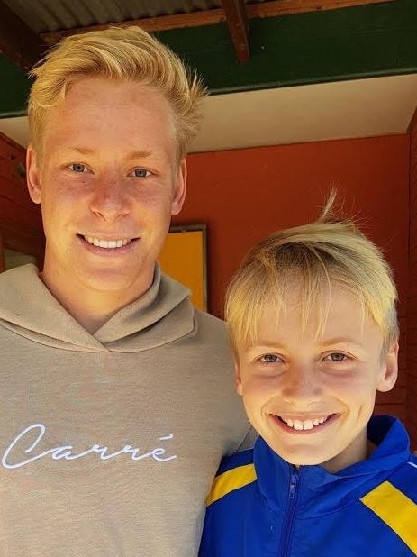 Isaac Heeney with a 10-year-old Max King, during one of Heeney’s visits to back Cardiff. Photo: King family.