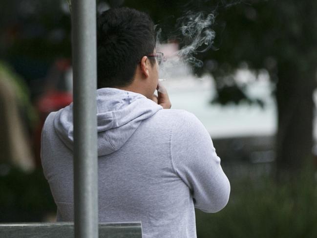 A smoker outside the Beecroft Place shopping centre. Picture: Tim Pascoe