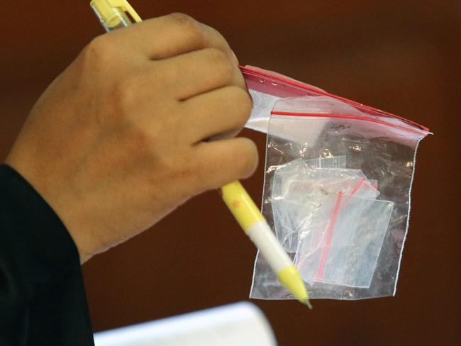 A prosecutor shows the plastic clip containing the rest of evidence during a trial at Denpasar District Court, where Van Iersel and his friend Cabantog were allegedly carrying 1.12 grams of cocaine at Lost City Night Club in Canggu. Picture: Lukman S. Bintoro