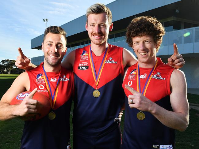 Lockleys Demons players Liam Narcy who kicked the winning goal for the A grade ,Chad Hamilton from the B grade and Brad Broughton who won best on ground for the A grade  in winning the As,Bs and C grade premierships pose for a photo outside their clubrooms .Monday September 28,2020.Picture Mark Brake