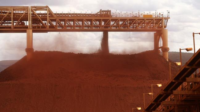 Australia sends 30 per cent of its exports to China, including iron ore, like that shown here in a stockpile at a Fortescue Metals Group mining operation in the Pilbara region. Picture: Bloomberg