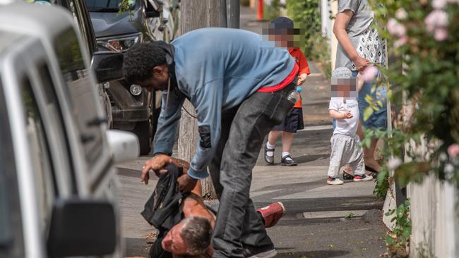 John, 51, suffers a heroin overdose in a side street about 200m from the Safe Injecting Room. Picture: Jason Edwards