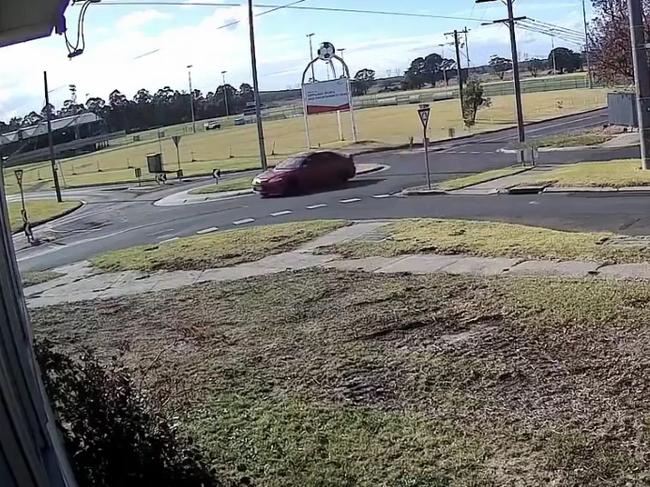 The driver of a red sedan was captured on CCTV speeding through a roundabout on Crinigan Rd in Morwell on Tuesday morning. Picture: Supplied