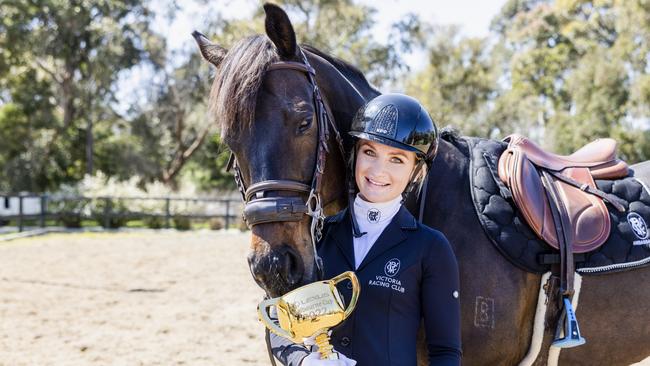 Jamie Kah with her retired racehorse, Brax, and the Lexus Melbourne Cup at her Mornington Peninsula farm. Picture: Nicole Cleary