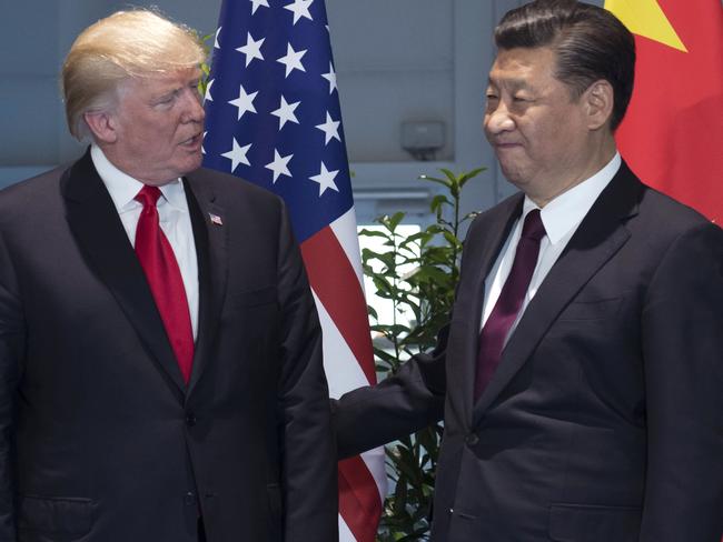 Donald Trump, left, and China's President Xi Jinping arrive for a meeting on the sidelines of the G-20 Summit. Picture: Saul Loeb/Pool Photo via AP