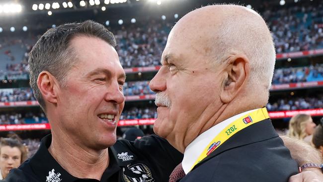 MELBOURNE, AUSTRALIA - SEPTEMBER 30: Craig McRae, Senior Coach of the Magpies is seen with Leigh Matthews during the 2023 AFL Grand Final match between the Collingwood Magpies and the Brisbane Lions at the Melbourne Cricket Ground on September 30, 2023 in Melbourne, Australia. (Photo by Dylan Burns/AFL Photos via Getty Images)