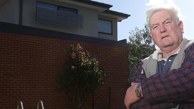 Alexander Sloan unhappy with the rear building with one uncovered window overlooking his pool. Picture: Hamish Blair