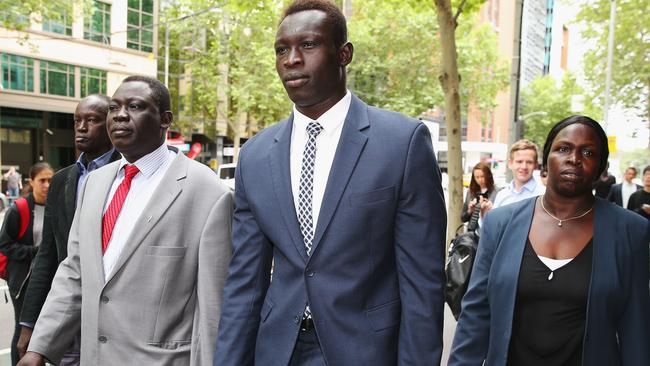 Majak Daw flanked by his parents William and Elizabeth in Melbourne in 2015. Picture: Getty Images