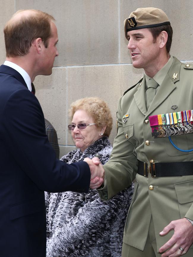 Prince William greets VC recipient Ben Roberts-Smith on ANZAC Day in Canberra.