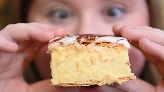 Maggie eyes off a Banana Boogie vanilla slice which made it onto the delicious. 100 Bets of the Best list. Picture: Keryn Stevens