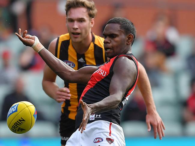 Irving Mosquito kicks a point against the Hawthorn Hawks.