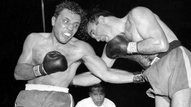 Jake LaMotta, left, pounds Marcel Cerdan in Round 3 of a 1949 world middleweight title bout.