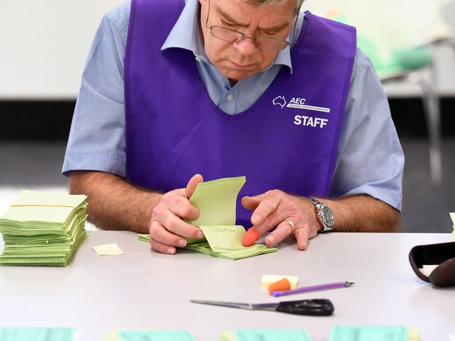 A temporary AEC worker counts votes in Sydney on July 5. Picture: William West.