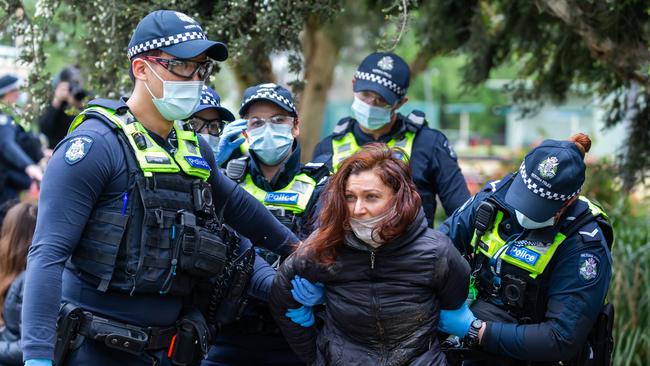 An anti-lockdown protester being detained by police in Princess Park. Picture: NCA NewsWire/Sarah Matray