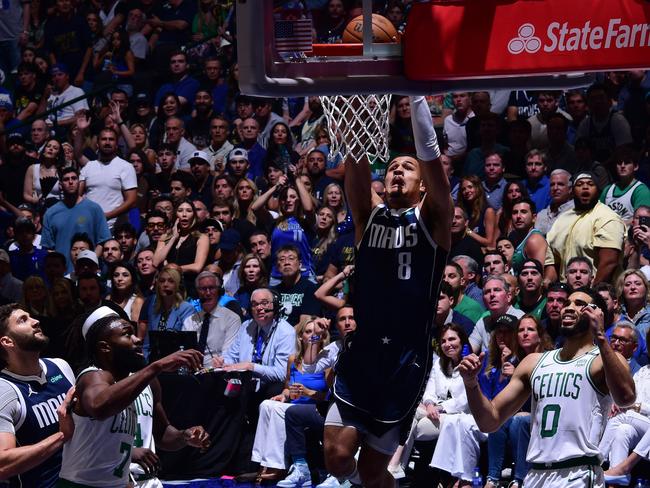 DALLAS, TX - JUNE 14: Josh Green #8 of the Dallas Mavericks dunks the ball during the game against the Boston Celtics  during Game 4 of the 2024 NBA Finals on June 14, 2024 at the American Airlines Center in Dallas, Texas. NOTE TO USER: User expressly acknowledges and agrees that, by downloading and or using this photograph, User is consenting to the terms and conditions of the Getty Images License Agreement. Mandatory Copyright Notice: Copyright 2024 NBAE (Photo by Garrett Ellwood/NBAE via Getty Images)