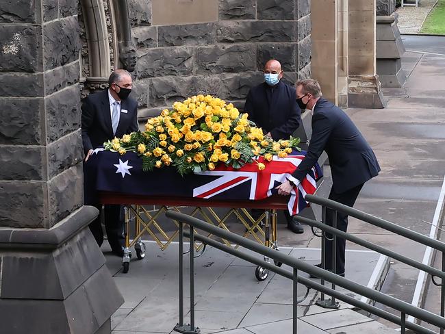 Newton’s coffin is guided into the cathedral. Picture: David Caird