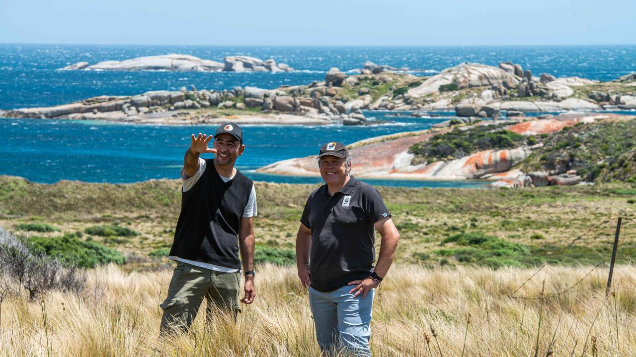 The WWF's Darren Grover (blue jeans) with the Tasmanian Aboriginal Centre's Andry Sculthorpe on lungtalanana (Clark Island) in Bass Strait, where the two groups are beginning a partnership to re-wild the island as part of the WWF's Rewilding Australia program (c) WWF