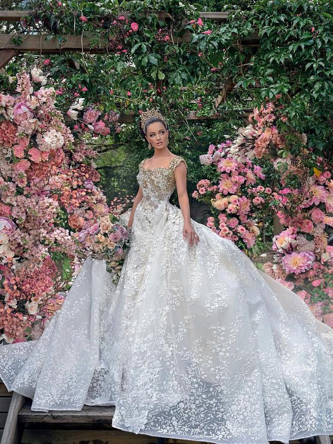 The extravagant gown was is a jewelled garden of gilded and crystal blossoms giving way to rose quartz, opal and frosted tourmaline tendrils the bride said. Photo: Instagram.