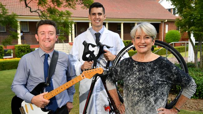 (L-R) Music teacher Brad Merrick, Science teacher Matt Hill and Robyn Leonard pose for a photo Barker College in Hornsby, Sydney, Wednesday, Feb. 7, 2018. (AAP Image/Joel Carrett)