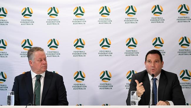 FFA Head of Leagues Greg O'Rourke (left) and FFA CEO James Johnson speak to the media in Sydney. (AAP Image/Joel Carrett)