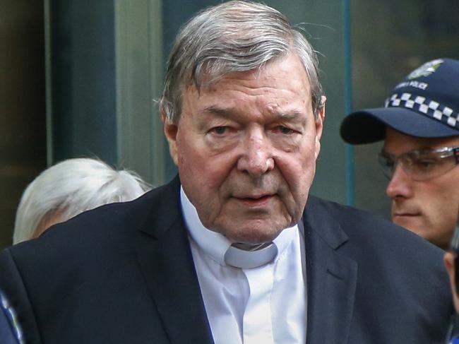 FILE - In this May 2, 2018, file photo, Cardinal George Pell, the most senior Catholic cleric to face sex charges, leaves court in Melbourne, Australia. Pell was sentenced in an Australian court on Wednesday, March 13, 2019 to 6 years in prison for molesting two choirboys in a Melbourne cathedral more than 20 years ago.  (AP Photo/Asanka Brendon Ratnayake, File)