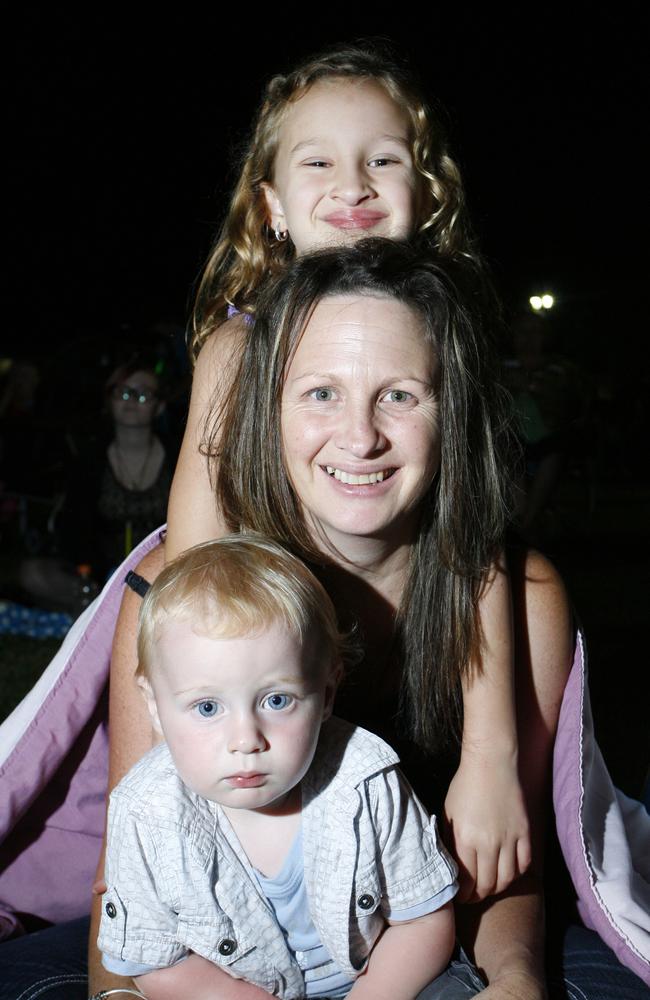 Jelie Lewis with her children Tiana Mathewson, 6, and baby Kane Mathewson at the New Year’s Eve celebration at North Ipswich Reserve in 2011. Picture: Claudia Baxter