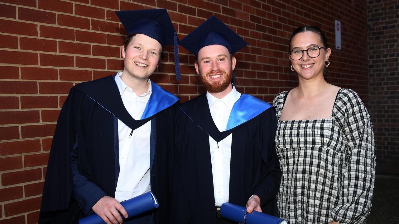 Brandon Hempel, Aaron Moore and Alexandra Moore at Deakin University post-graduation celebrations on Friday afternoon. Picture: Alan Barber