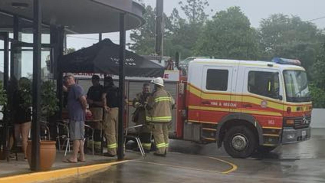 Gympie fire fighters finish testing the air inside Toucan Coffee for any toxic fumes after fire broke out in a coffee machine on Tuesday.