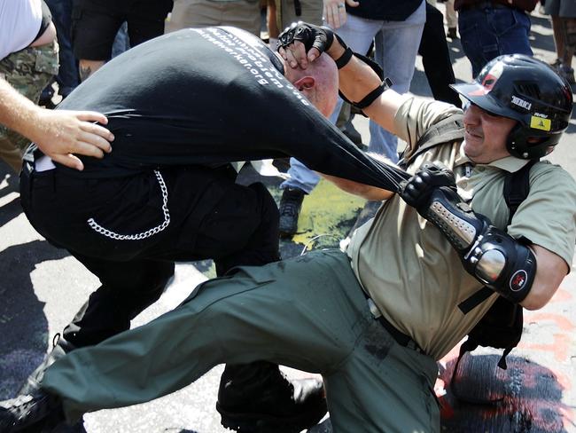 White nationalists, Neo-Nazis and members of the "alt-right" clash with counter-protesters as they enter Emancipation Park. Picture: Getty