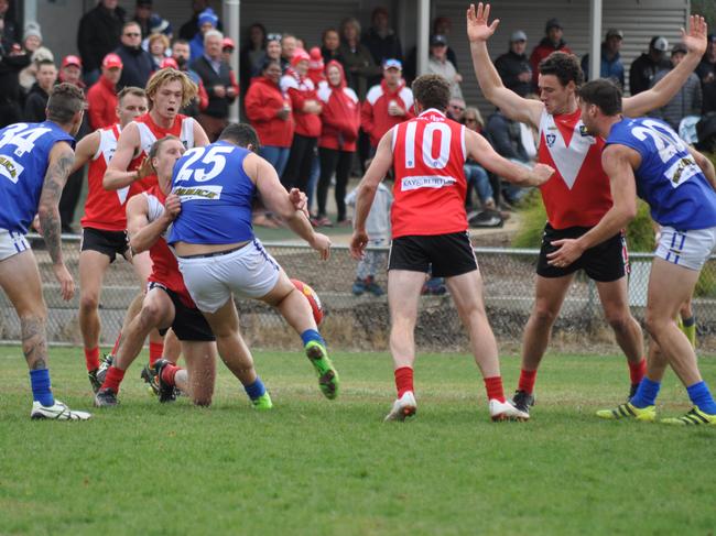 Brendan Fevola gets a kick away against Red Hill. Picture: Scott Grimster