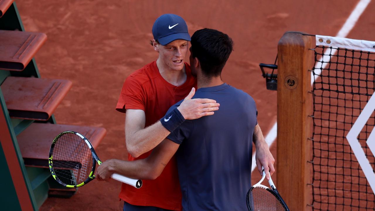 Carlos Alcaraz of Spain embraces at the net after his five set victory against Jannik Sinner of Italy. Picture: Clive Brunskill/Getty Images)