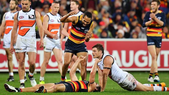 Richard Douglas and Eddie Betts celebrate a goal as Heath Shaw of the Giants looks on.