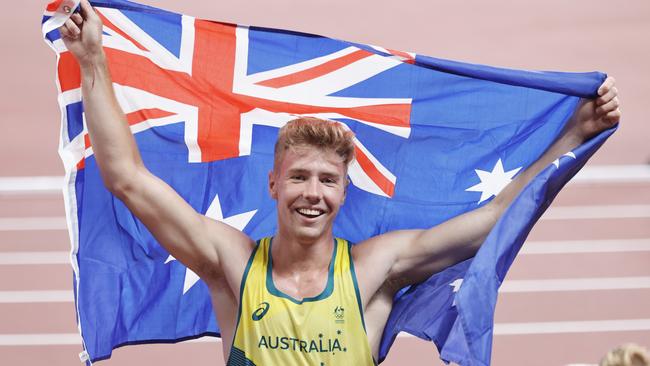 Ash Moloney with the Australian flag celebrate his Australian bronze. Picture: Alex Coppel.