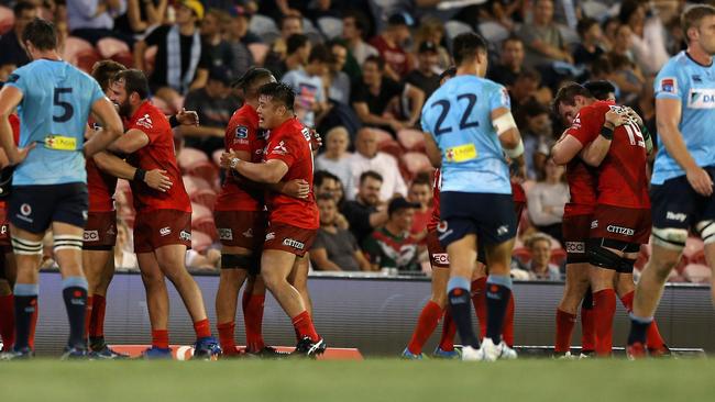 NEWCASTLE, AUSTRALIA — MARCH 29: Sunwolves players celebrate the win during the round seven Super Rugby match between the Waratahs and the Sunwolves at McDonald Jones Stadium on March 29, 2019 in Newcastle, Australia. (Photo by Ashley Feder/Getty Images for SUNWOLVES)