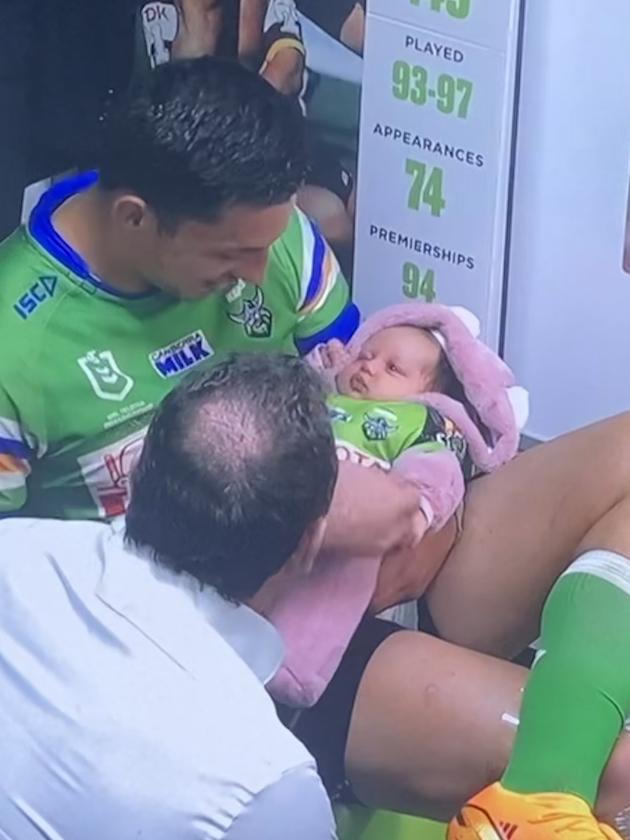 Joseph Tapine with daughter Ilua and coach Ricky Stuart after the Raiders' win over Parramatta.