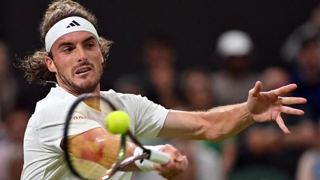 Greece's Stefanos Tsitsipas playing Britain's Andy Murray at Wimbledon on July 6, 2023. (Photo by Glyn KIRK / AFP)