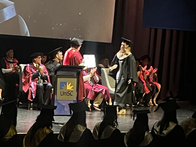 Graduates from the University of the Sunshine Coast's Fraser Coast campus celebrating at the Brolga Theatre.