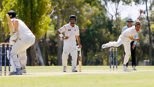 Cameron Fatchen bowling in Kensington’s A-grade semi-final victory against Adelaide University last week. Picture: AAP/Emma Brasier