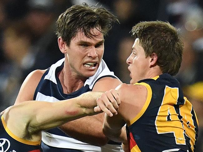 Tom Hawkins of the Cats (second from left) and Matt Crouch of the Crows (right) are seen after a melee during the Round 11 AFL match between the Geelong Cats and the Adelaide Crows at Simonds Stadium in Geelong, Friday, June 2, 2017. (AAP Image/Julian Smith) NO ARCHIVING, EDITORIAL USE ONLY