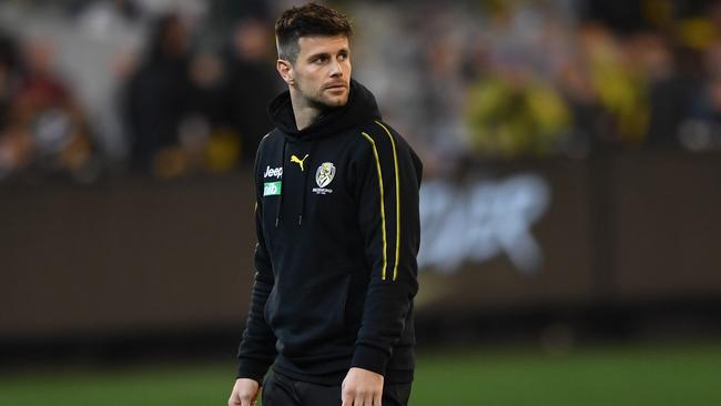 Trent Cotchin after hurting his hamstring on Friday night. Picture: Julian Smith (AAP).