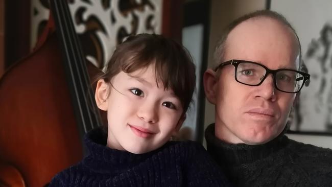 Here’s hoping our future resembles that of Aussie Simon Carter and daughter Imogen in their flat in Wuhan, China. Picture: Supplied