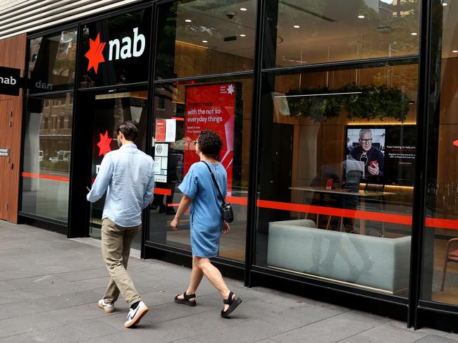 SYDNEY, AUSTRALIA - MARCH 27: Pedestrians walk past National Australia Bank Ltd. branch at Barangaroo on March 27, 2024 in Sydney, Australia. In the last quarter, Westpac Bank reported a quarterly cash profit of A$1.8 billion, meeting consensus expectations, while NAB experienced a 17% decline in first-quarter cash profit compared to the previous corresponding period, reflecting varying performances among the major Australian banks. (Photo by Brendon Thorne/Getty Images) (Photo by Brendon Thorne/Getty Images)