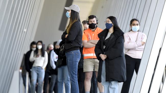 People queue at the vaccination clinic at the Melbourne Exhibition and Convention Centre. Picture: NCA NewsWire / Andrew Henshaw