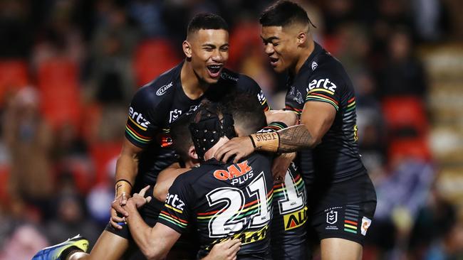 Nathan Cleary is the centre of attention after scoring a try.