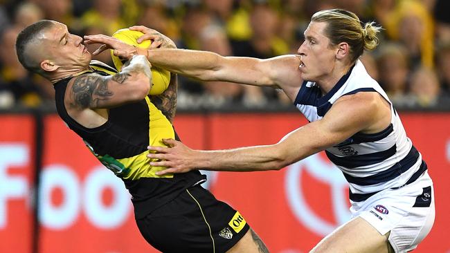 Dustin Martin marks in front of Mark Blicavs in last year’s preliminary final.