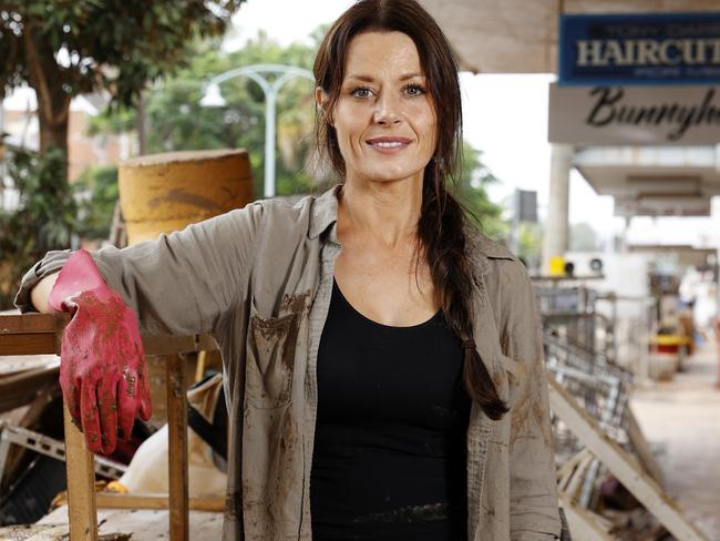 Ms West pictured helping clean out buildings in Lismore with a group of volunteers following last month’s floods. Picture: Jonathan Ng