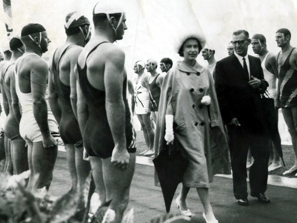 <b>1963 – Gold Coast</b> The 1963 visit included a memorable stop on the Gold Coast, where lifesavers formed a 50-man guard of honour representing 44 Queensland surf clubs and six from northern New South Wales. Having earlier travelled to Brisbane on the <i>Royal Yacht Britannia</i>, the Queen flew into a rainy Coolangatta to watch the Royal Surf Carnival from a dais overlooking the windswept beach.