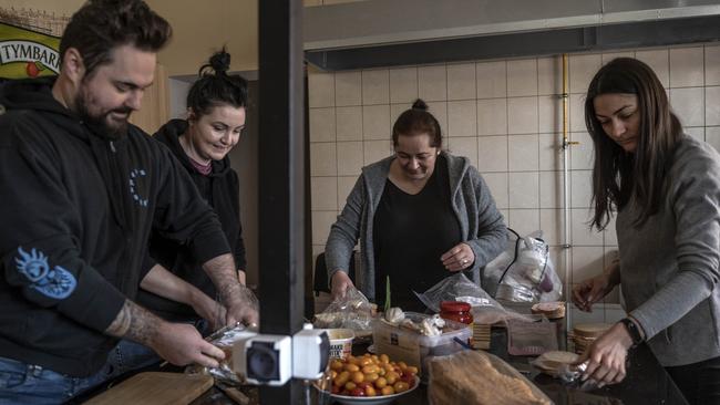 Kuba, Elwira, Aneta, Elena and Beata Lugowska prepare food for Ukrainian refugees at the Budomierz Border Crossing. Picture: Annabel Moeller