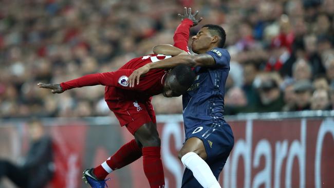 LIVERPOOL, ENGLAND - DECEMBER 16:  Naby Keita of Liverpool battles for possession with Marcus Rashford of Manchester United during the Premier League match between Liverpool FC and Manchester United at Anfield on December 16, 2018 in Liverpool, United Kingdom.  (Photo by Clive Brunskill/Getty Images)